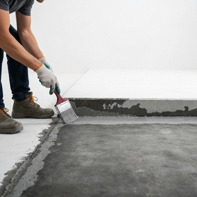 User applying waterproofing sealant